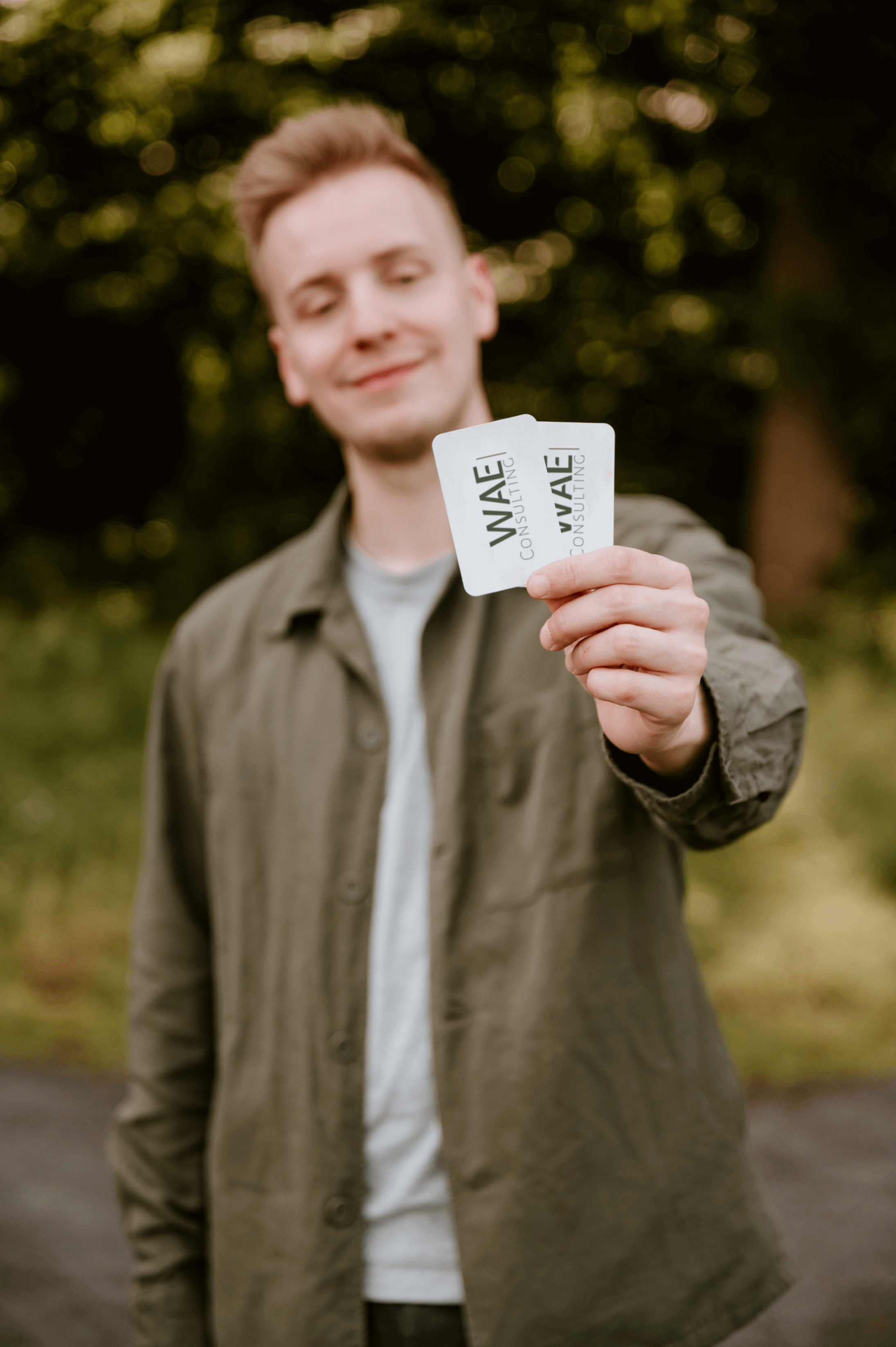 Jasey showing business cards